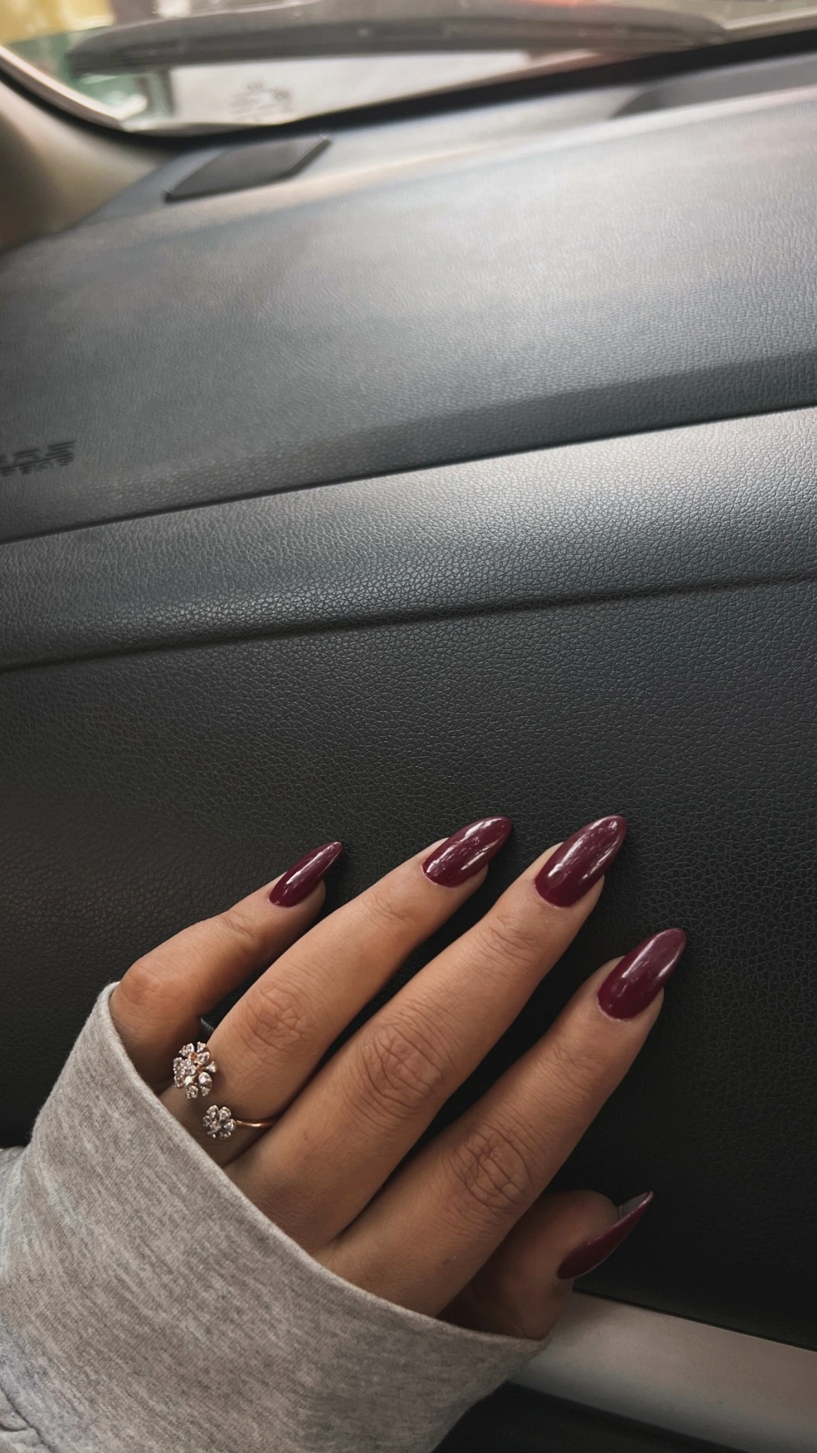 Burgundy nail finish at The Glamourra